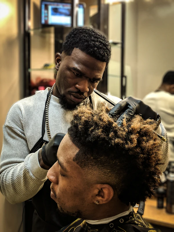 Barber styling curly hair
