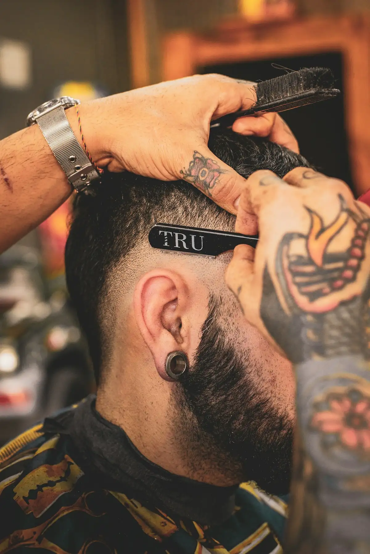 Barber using a straight razor